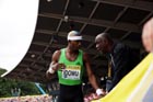 Triple Jumper Phillips Idowu is given advice by his coach Aston Moore, 2011 Aviva London Grand Prix